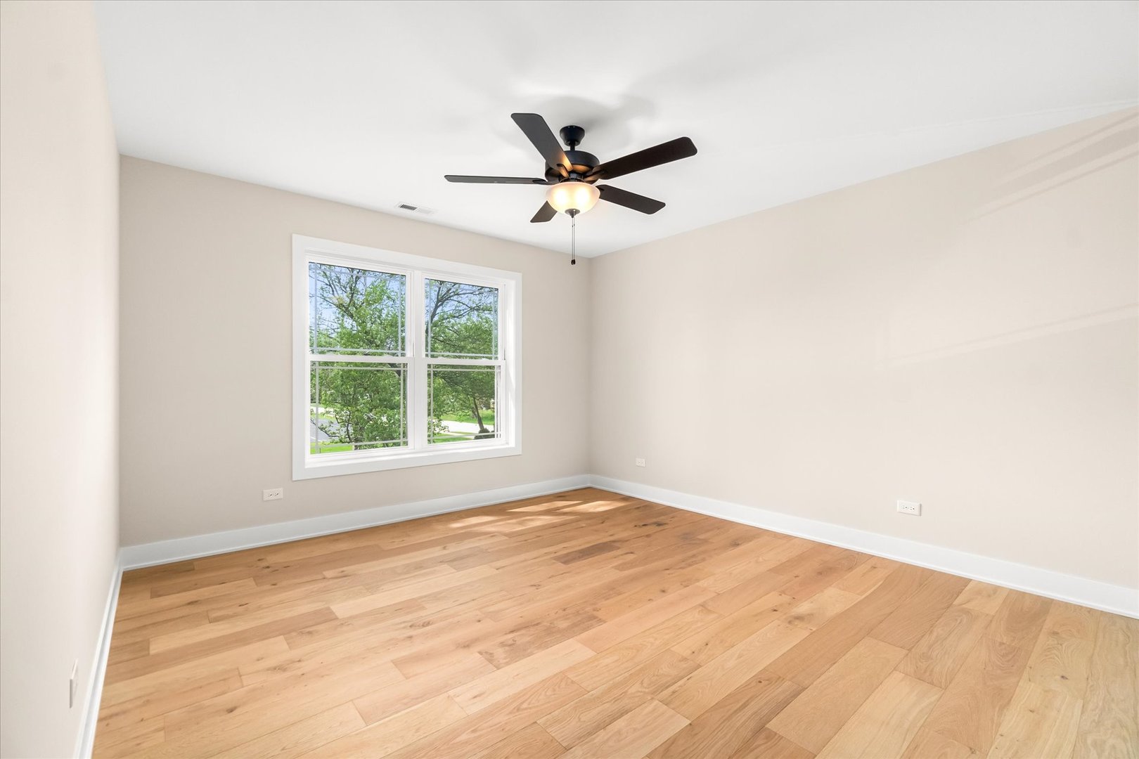 520 North Sleight Street Naperville, IL 60563 - Photo 35 of 51 an empty room with a window and a ceiling fan