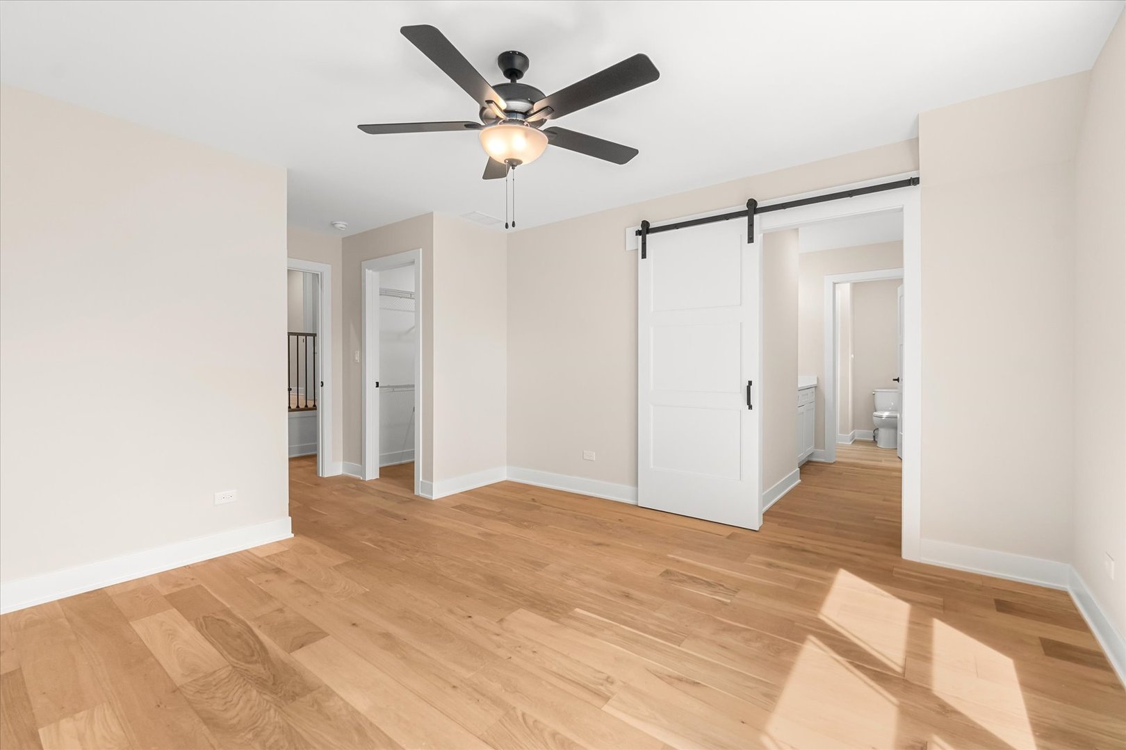 520 North Sleight Street Naperville, IL 60563 - Photo 36 of 51 a view of a big room with wooden floor and a ceiling fan
