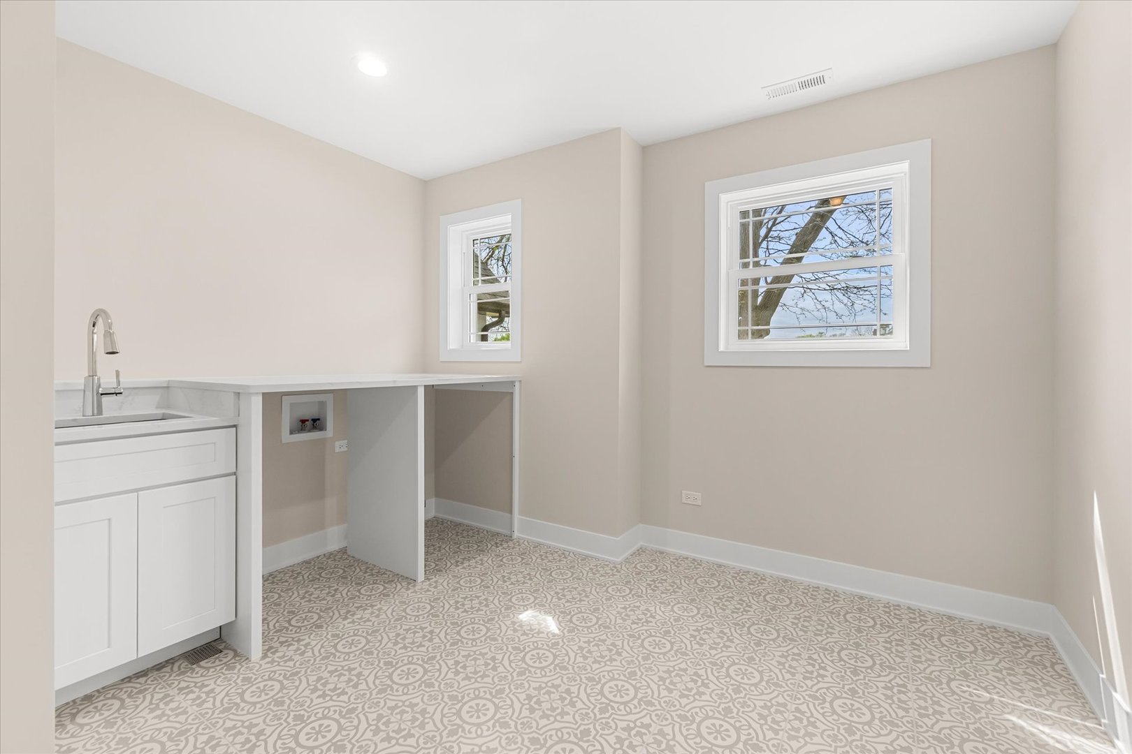 520 North Sleight Street Naperville, IL 60563 - Photo 44 of 51 an empty room with a kitchen and a window