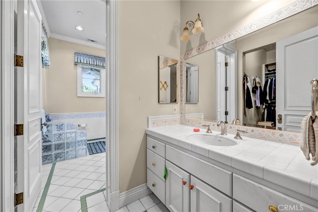 900 Fallen Leaf Road Arcadia, CA 91006 - Photo 42 of 51 a bathroom with a double vanity sink and a mirror