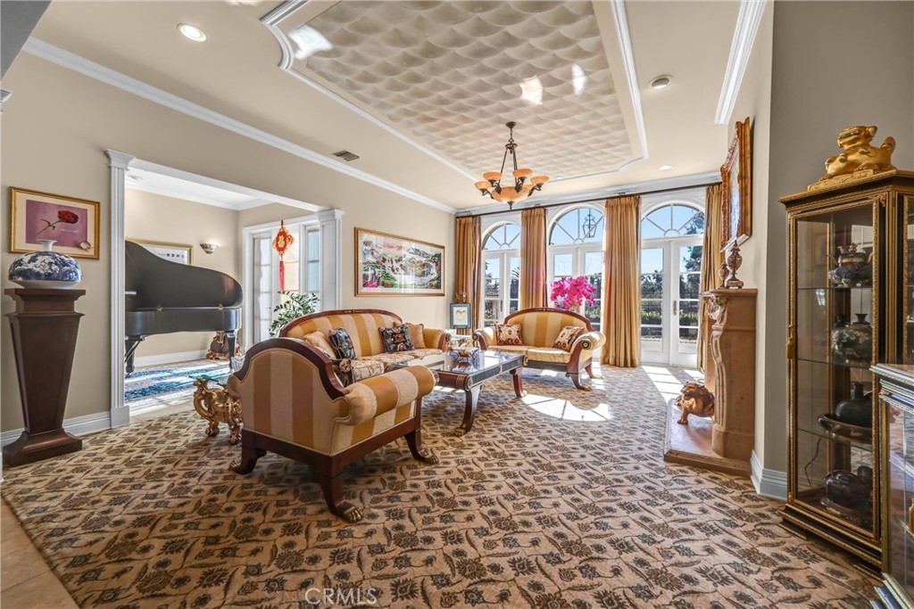 900 Fallen Leaf Road Arcadia, CA 91006 - Photo 10 of 51 a living room with furniture a chandelier and a rug