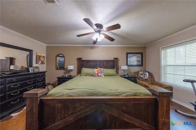 a bedroom with a bed and furniture