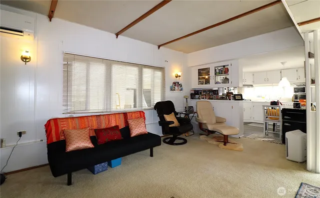 a bed room with a bed and a chair