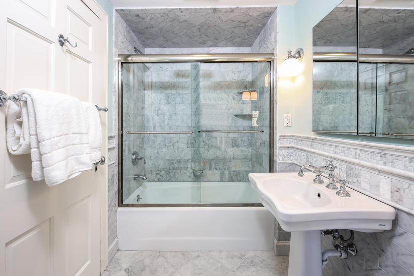 2 Meadowbrook Road Darien, CT 06820 - Photo 14 of 36 a bathroom with a sink and mirror with bathtub