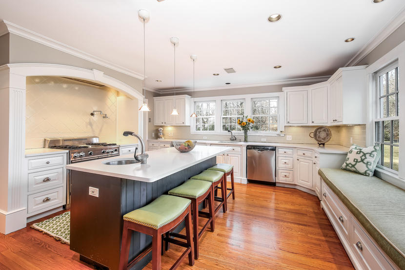 2 Meadowbrook Road Darien, CT 06820 - Photo 8 of 36 a kitchen with a sink stove cabinets and wooden floor