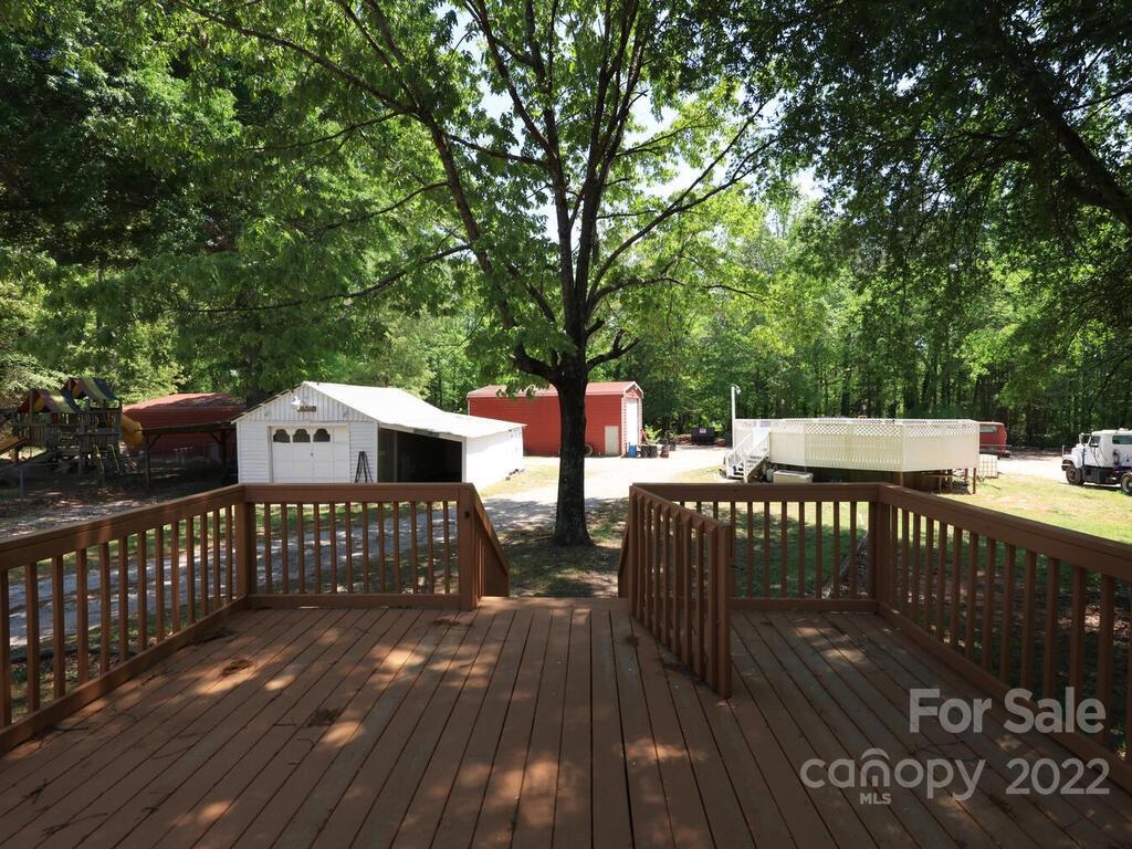 132 Mt Mourne Loop Mooresville, NC 28117 - Photo 11 of 17 a view of a wooden deck with furniture