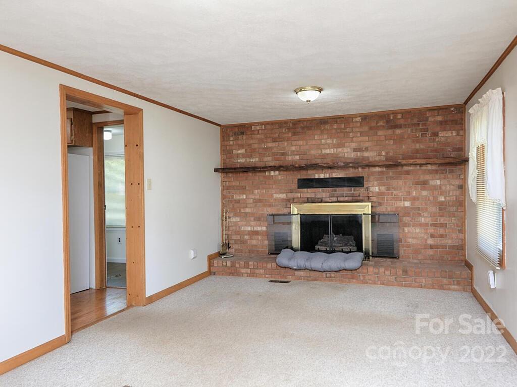132 Mt Mourne Loop Mooresville, NC 28117 - Photo 3 of 17 a living room with a fireplace