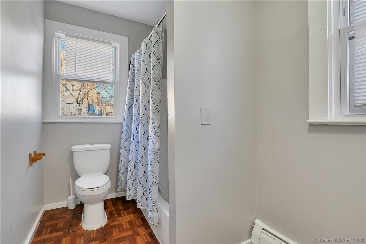 18 Union Street New Britain, CT 06051 - Photo 16 of 24 a white toilet sitting next to a bathroom sink