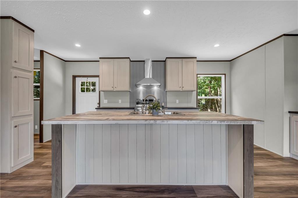 3078 Anderson Highway Hartwell, GA 30643 - Photo 11 of 37 a large kitchen with stainless steel appliances a large counter top a stove and a refrigerator