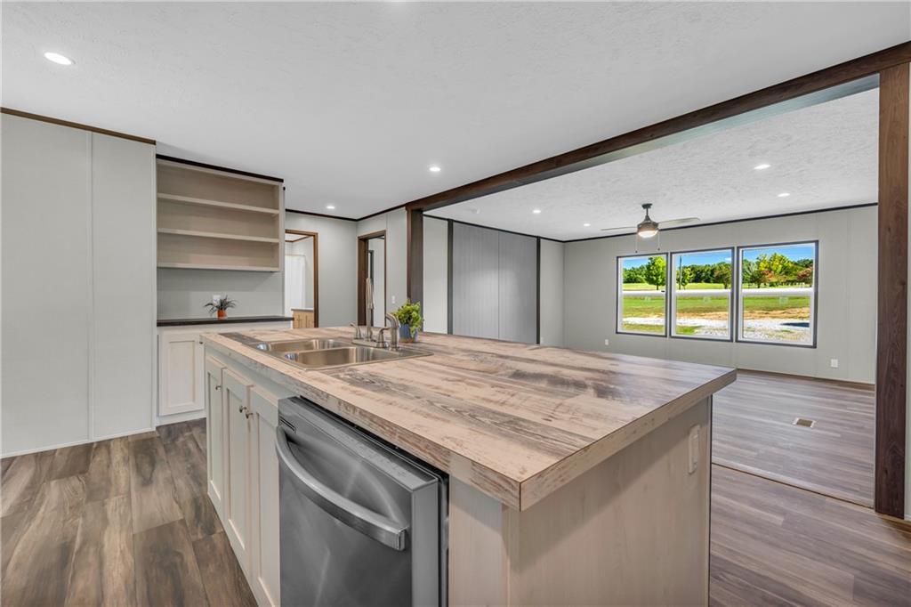 3078 Anderson Highway Hartwell, GA 30643 - Photo 15 of 37 a kitchen with a stove and a wooden floor