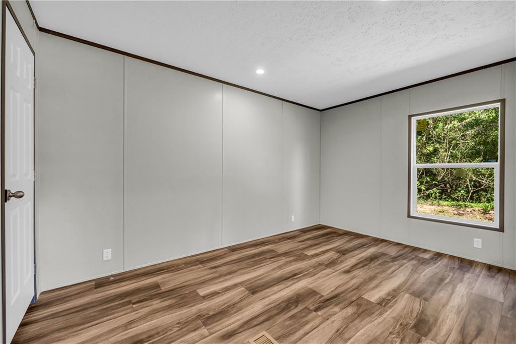 3078 Anderson Highway Hartwell, GA 30643 - Photo 23 of 37 a view of room with window and hardwood floor