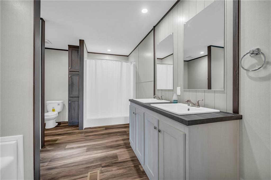 3078 Anderson Highway Hartwell, GA 30643 - Photo 29 of 37 a bathroom with a sink and a mirror