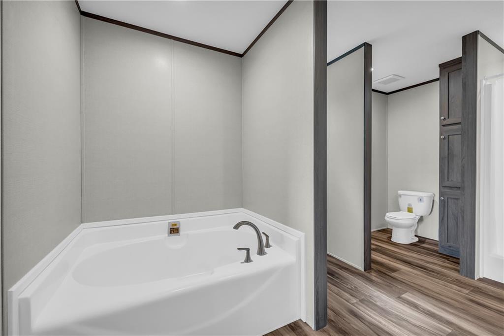 3078 Anderson Highway Hartwell, GA 30643 - Photo 30 of 37 a bathroom with a bathtub and a toilet