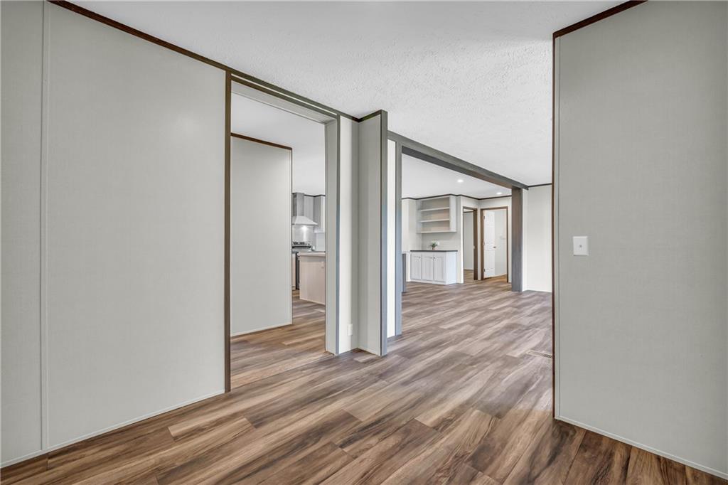 3078 Anderson Highway Hartwell, GA 30643 - Photo 9 of 37 a view of a hallway with wooden floor and entryway