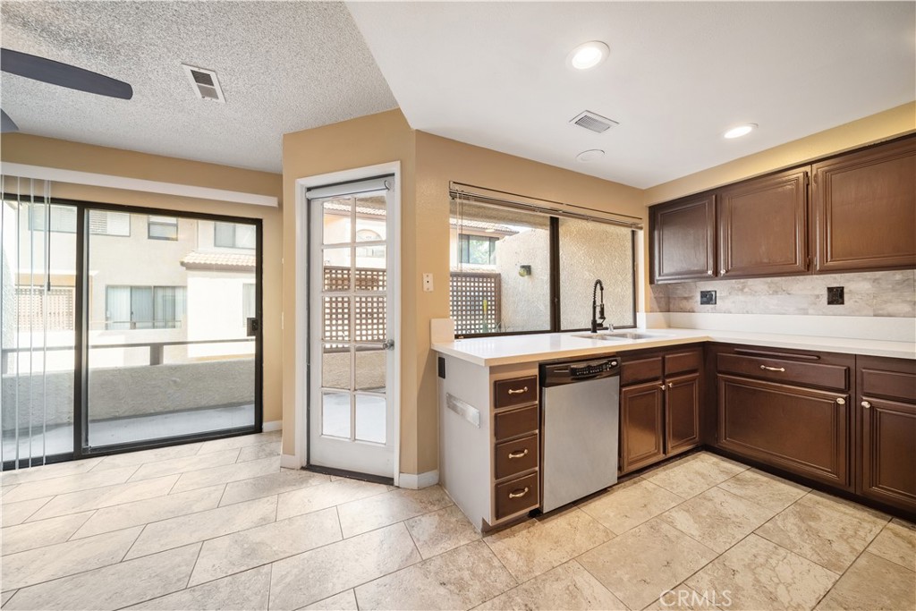 3 Saddlewood Lane Pomona, CA 91766 - Photo 12 of 40 a kitchen with stainless steel appliances granite countertop a stove and a sink