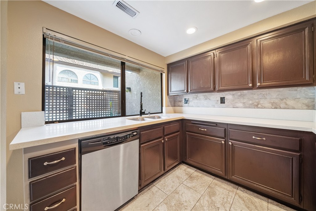 3 Saddlewood Lane Pomona, CA 91766 - Photo 13 of 40 a kitchen with granite countertop cabinets stainless steel appliances and a sink