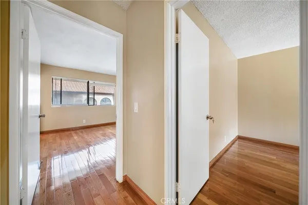 a view of wooden floor in an empty room