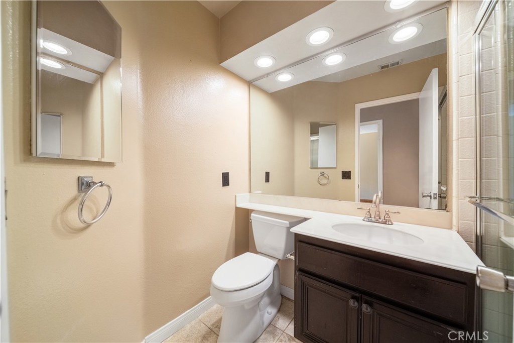 3 Saddlewood Lane Pomona, CA 91766 - Photo 22 of 40 a bathroom with a sink toilet and mirror