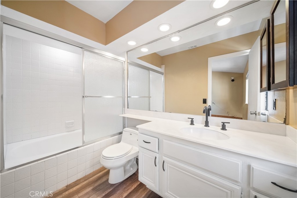 3 Saddlewood Lane Pomona, CA 91766 - Photo 26 of 40 a bathroom with a toilet a sink and a mirror