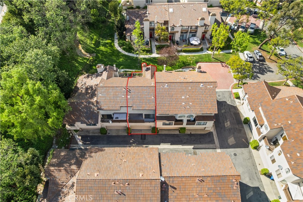 3 Saddlewood Lane Pomona, CA 91766 - Photo 33 of 40 an aerial view of a residential apartment building with a yard