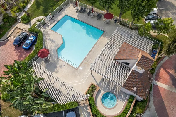 an aerial view of multiple houses with yard