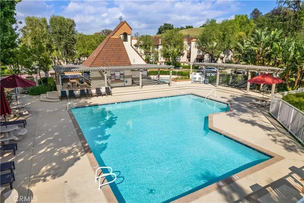 swimming pool view with a outdoor seating