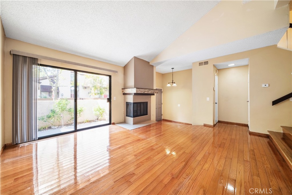 3 Saddlewood Lane Pomona, CA 91766 - Photo 5 of 40 a view of a room with wooden floor and a window