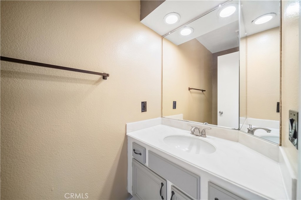 3 Saddlewood Lane Pomona, CA 91766 - Photo 9 of 40 a bathroom with a sink and a mirror