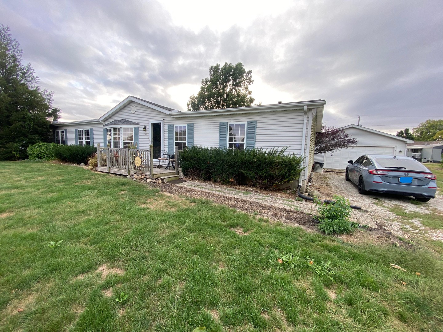 207 South Main Street Fithian, IL 61844 - Photo 1 of 23 a front view of a house with a yard and garage