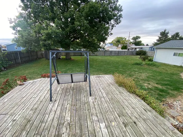 a view of backyard with green space