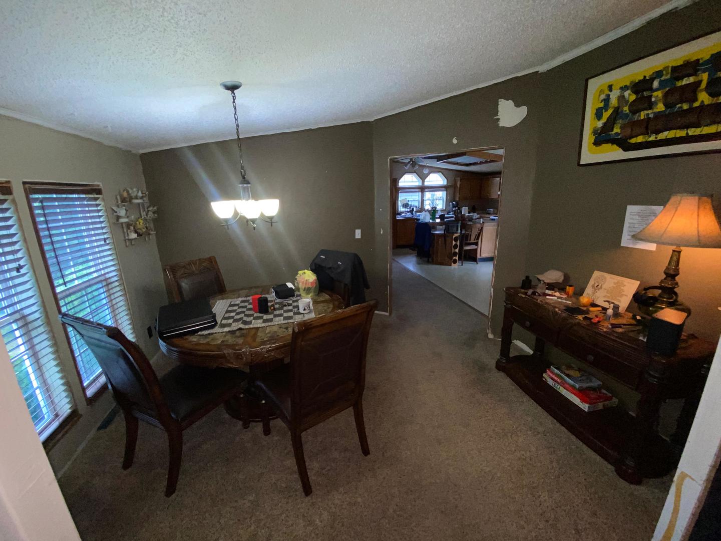207 South Main Street Fithian, IL 61844 - Photo 22 of 23 a living room with furniture and a chandelier