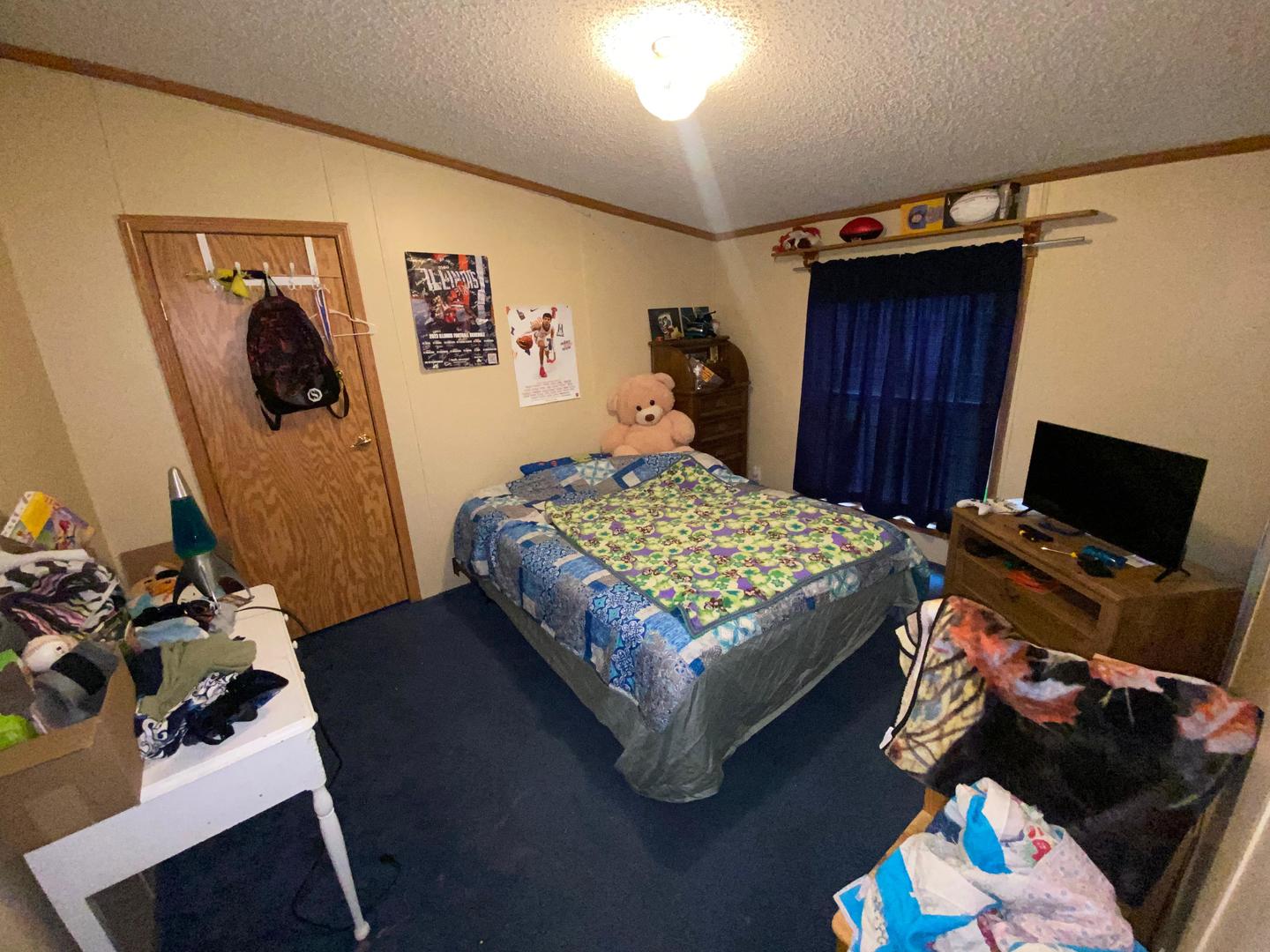 207 South Main Street Fithian, IL 61844 - Photo 4 of 23 a bedroom with a bed and wooden floor