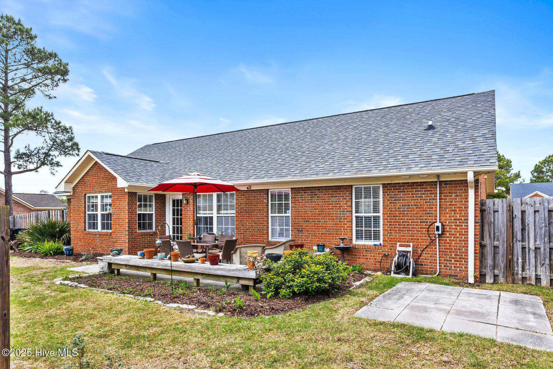 7002 Springer Road Wilmington, NC 28411 - Photo 23 of 23 Hot tub pad & hookup featured on right side of backyard