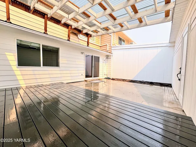 a view of a balcony with wooden floor