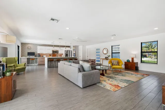 a living room with furniture and a table