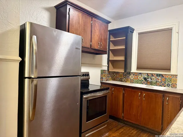 a white refrigerator freezer sitting inside of a kitchen