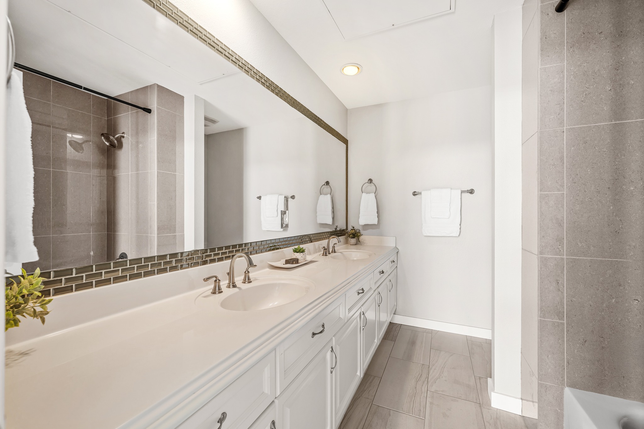 2918 Ranch Road 620 North, Unit S242 Austin, TX 78734 - Photo 29 of 35 Dual vanity sinks provide ample space in this well-appointed primary bathroom.