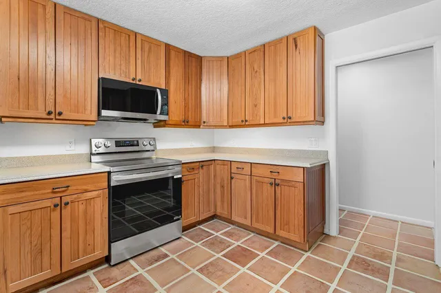 a bedroom with a large bed and a large window