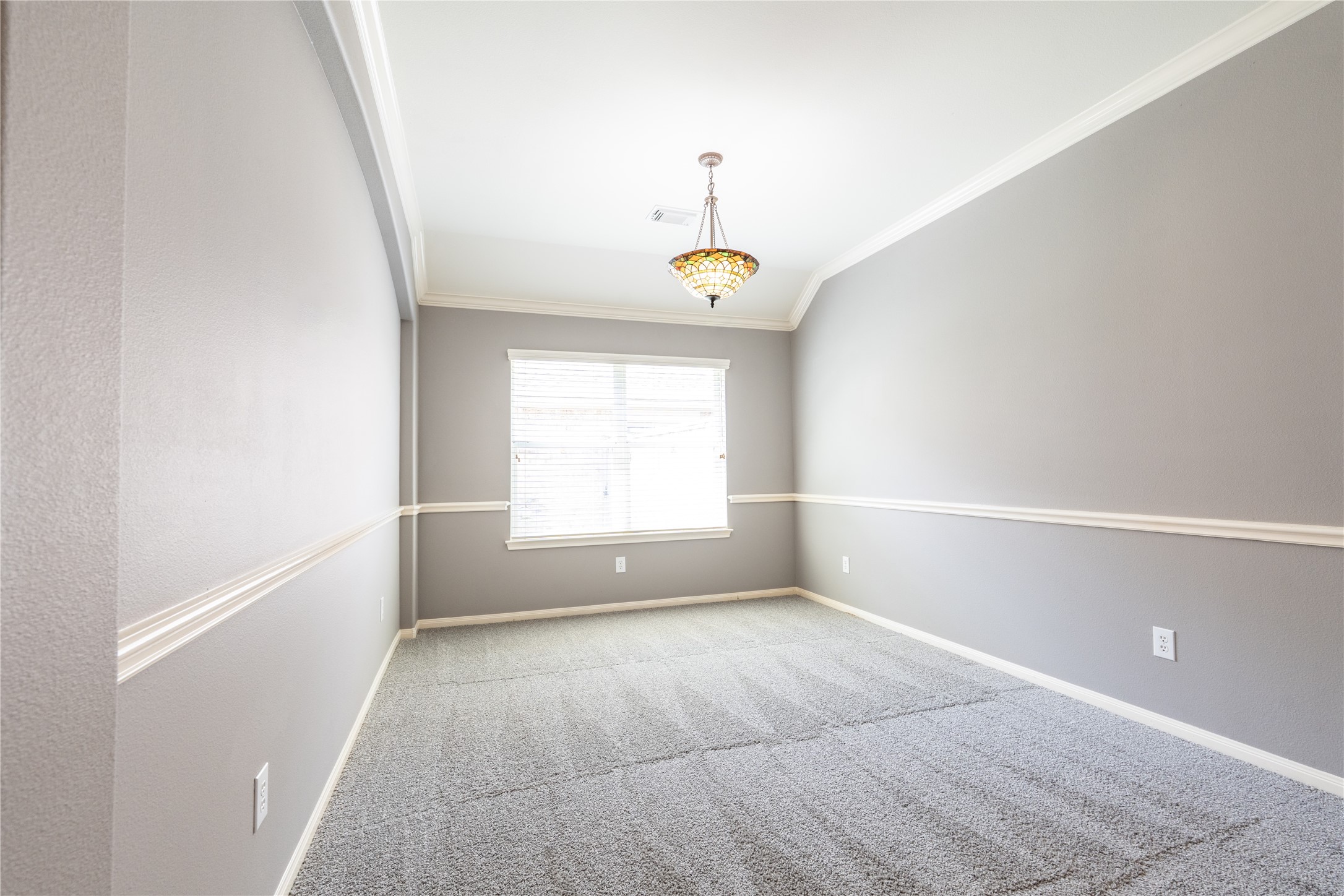 10619 Crownsedge Drive Spring, TX 77379 - Photo 6 of 38 The formal dining area has crown white trim and crown molding along with a large window to let in natural light and open up the space. Plenty of space for a large dining table and entertaining.