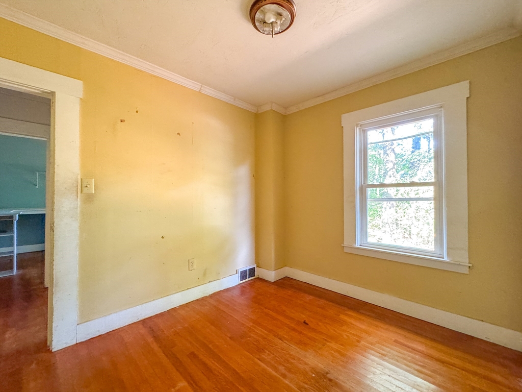 14 Brook Street Ayer, MA 01432 - Photo 19 of 26 a view of empty room with wooden floor and fan