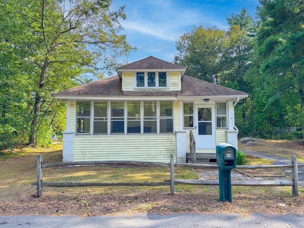 14 Brook Street Ayer, MA 01432 - Photo 2 of 26 a front view of a house with a yard