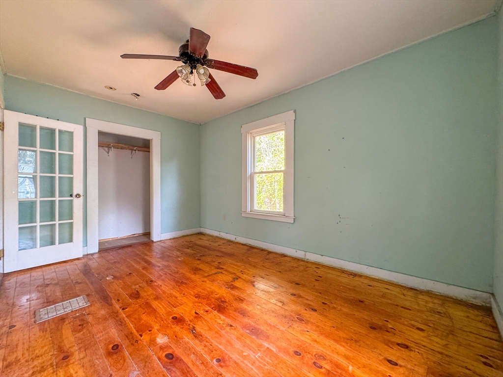 14 Brook Street Ayer, MA 01432 - Photo 25 of 26 a view of a livingroom with a ceiling fan and window