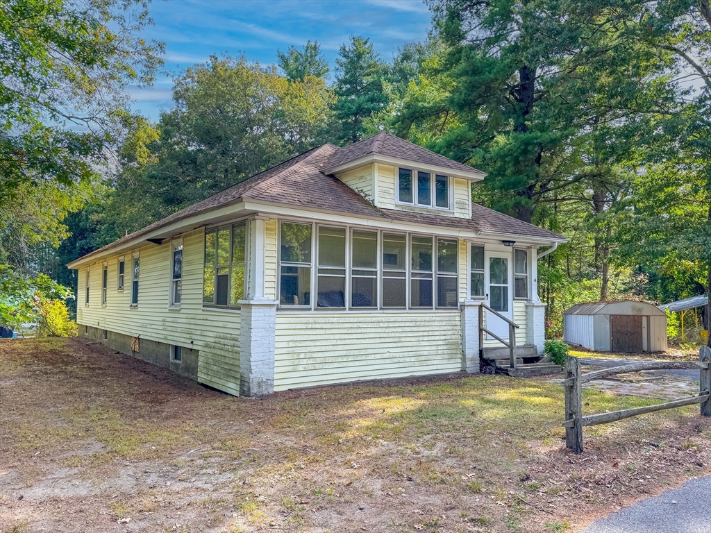 14 Brook Street Ayer, MA 01432 - Photo 3 of 26 a front view of a house with a yard