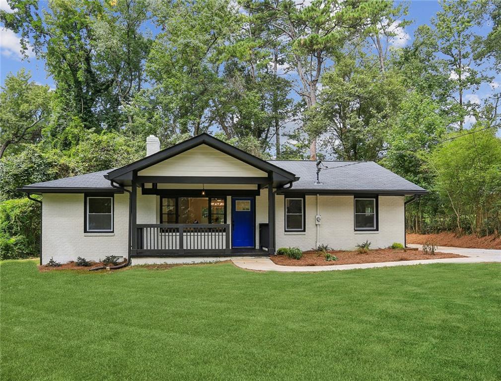 a front view of house with yard and green space