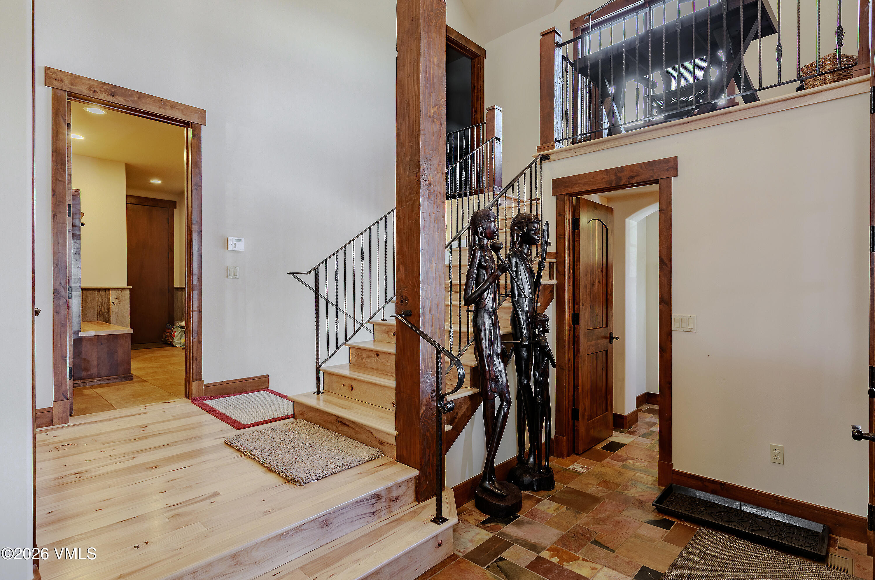 2753 East Haystacker Drive Eagle, CO 81631 - Photo 17 of 41 a view of a hallway with wooden floor and stairs