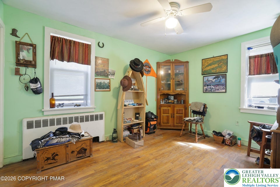 1207 Seese Hill Road Canadensis, PA 18325 - Photo 13 of 49 Hardwood flooring and multiple windows bring natural light and warmth to this versatile room.