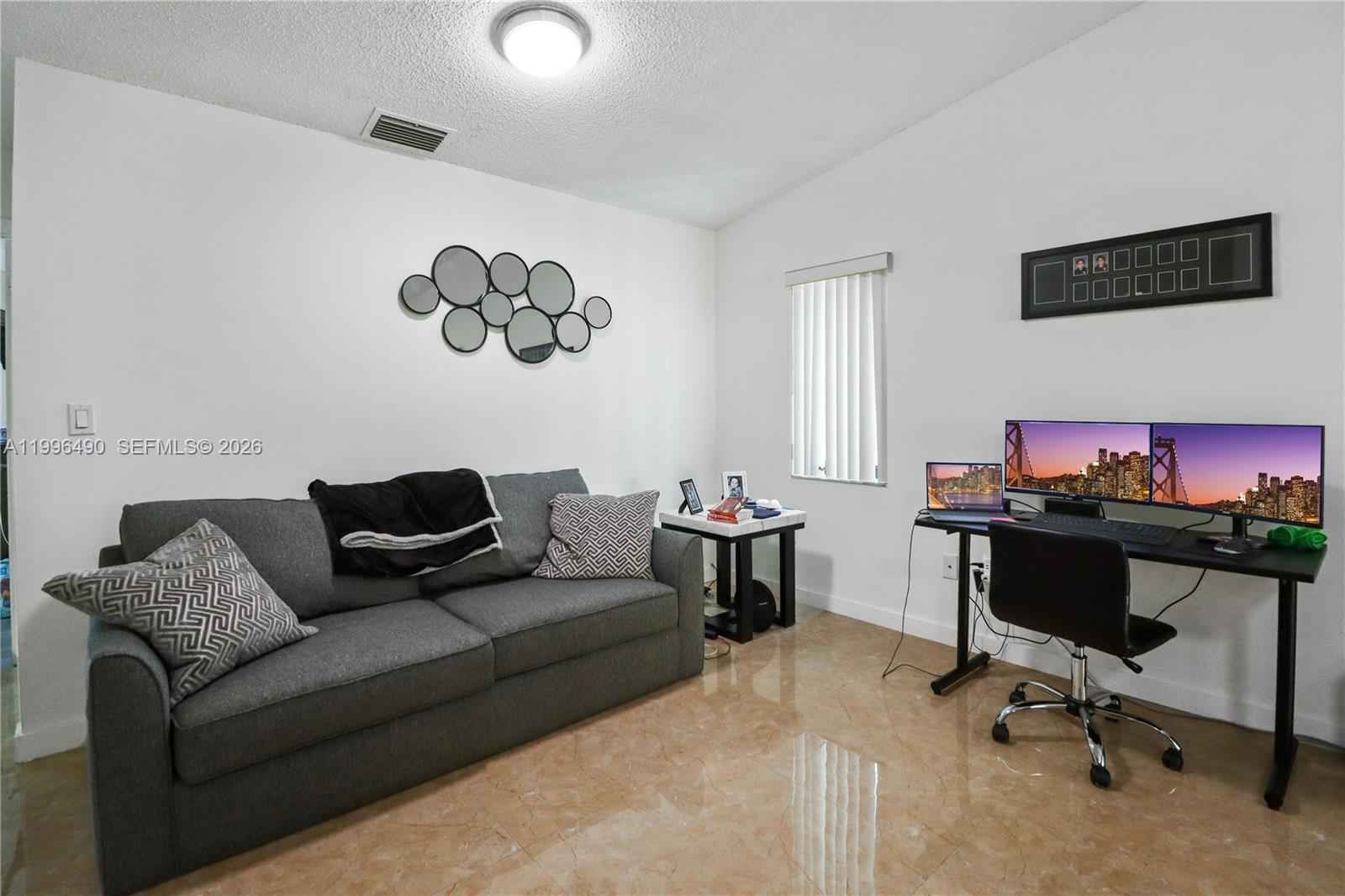 10940 Southwest 143rd Court Miami, FL 33186 - Photo 12 of 31 a living room with furniture