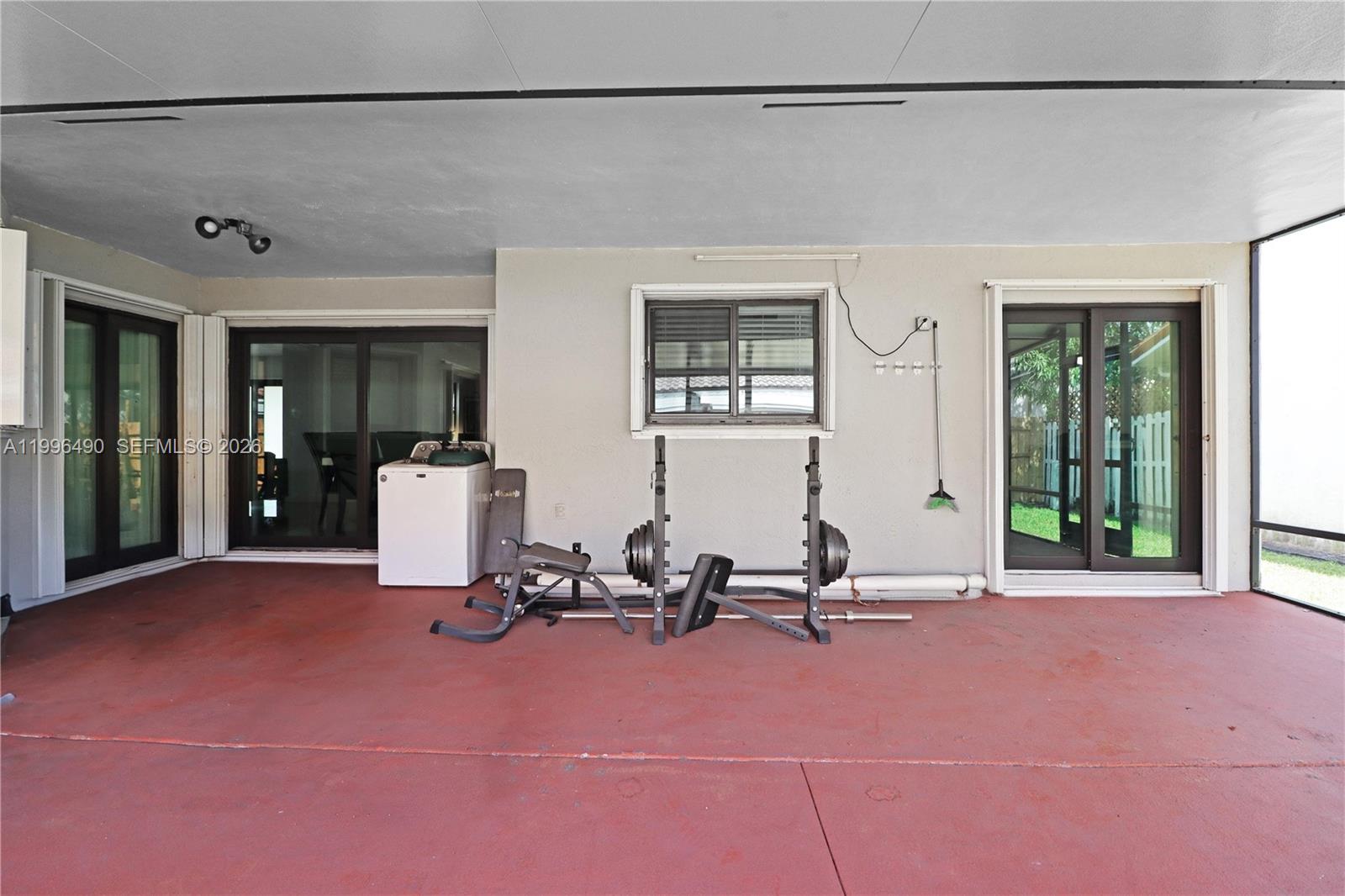 10940 Southwest 143rd Court Miami, FL 33186 - Photo 26 of 31 a view of a room with gym equipment