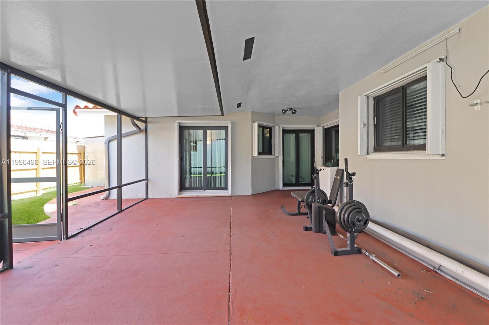 10940 Southwest 143rd Court Miami, FL 33186 - Photo 27 of 31 a view of an empty room with a window