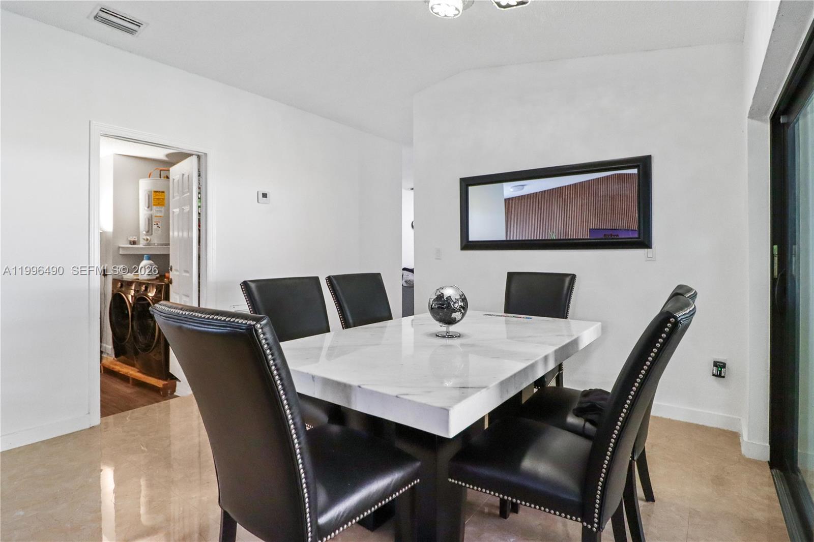 10940 Southwest 143rd Court Miami, FL 33186 - Photo 6 of 31 a view of a dining room with furniture